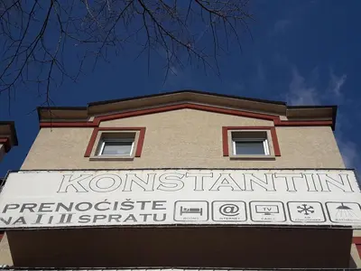 a sign on the side of a building at Prenoćište Konstantin 2008 in Niš