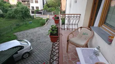 a small car is parked on a balcony at Apartmani Boss in Vrnjačka Banja