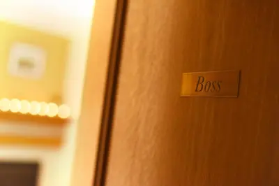 a door with a sign that says boss on it at Apartmani Boss in Vrnjačka Banja