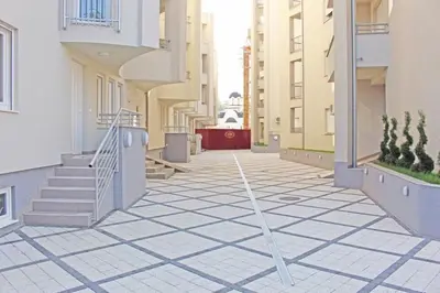an empty city street with stairs and buildings at Holiday Wing Apartment 2 in Jagodina