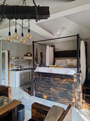 a bedroom with a large bed in a room at Apartment Mia in Vrnjačka Banja