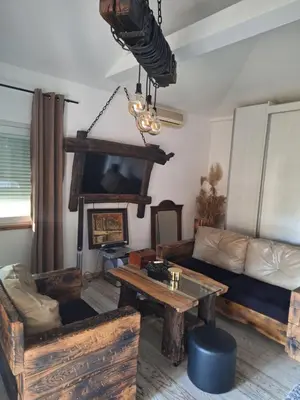a living room with a couch and a table at Apartment Mia in Vrnjačka Banja