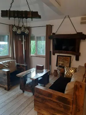 a living room with a couch and a table at Apartment Mia in Vrnjačka Banja
