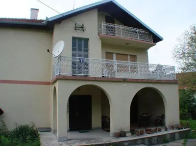 a large house with a balcony on top of it at Studio Elizabeta in Soko Banja