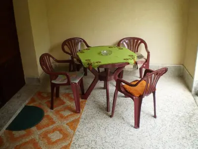 a table and two chairs and a green table and chairs at Studio Elizabeta in Soko Banja