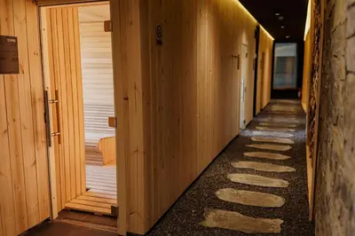 a hallway of a building with wooden walls at Studio Unna in Kopaonik