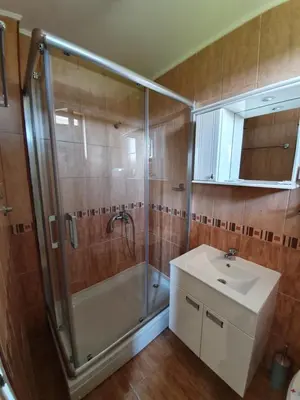 a bathroom with a shower and a sink at Kompleks Fontana in Vladičin Han