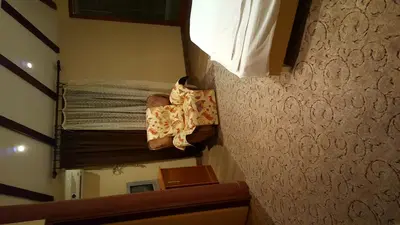 a baby laying on a bunk bed in a room at Kompleks Fontana in Vladičin Han