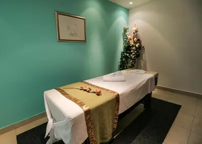 a room with a bed with a table and flowers at Hotel Stara Planina in Ćuštica