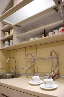 a kitchen counter with two cups and a sink at Zafir 1 in Vrnjačka Banja