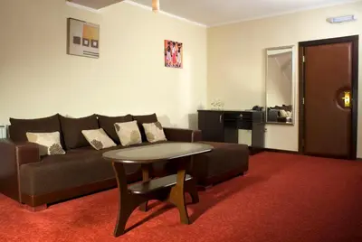 a living room with a couch and a table at Vila Prica in Niška Banja