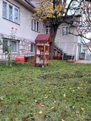 a small play house in the yard of a house at Sobe SANjA in Pirot