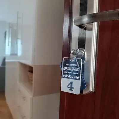 a door lock with a price tag on it at Apartments Karamarković in Vrnjačka Banja