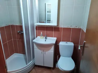 a bathroom with a toilet and a sink and a shower at Studio Dunja in Vrnjačka Banja