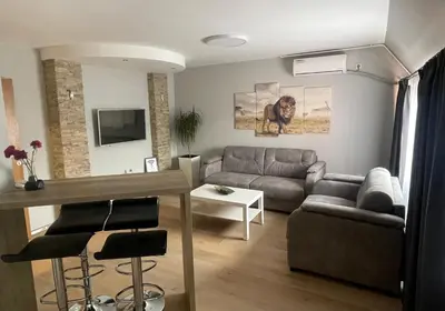 a living room with a couch and a table at Leo in Niš
