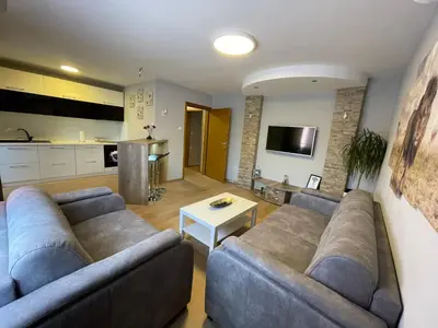 a living room with a couch and a table at Leo in Niš