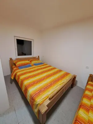 a bedroom with a large bed and a flat screen tv at STD 