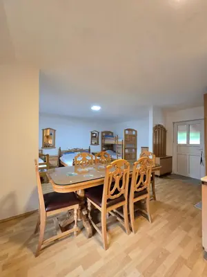 a dining room with a table and chairs at STD 