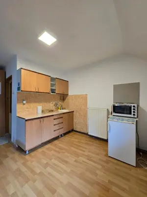 an empty kitchen with a stove and a refrigerator at STD 
