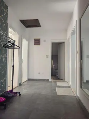 an empty room with a gym with a treadmill at Apartment Holiday in Vrnjačka Banja