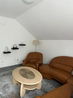 a living room with a couch and a table at Apartment Holiday in Vrnjačka Banja