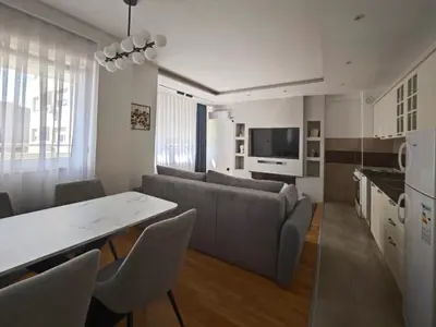 a living room with a couch and a table at NAR Royalton Accommodation in Niš