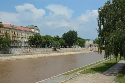 a view of a river in a city with buildings at Trident Apartments 2 in Niš