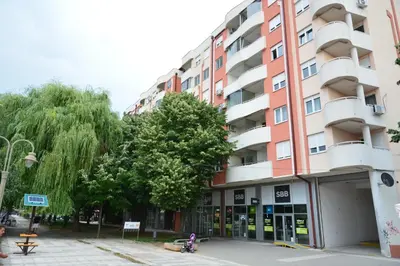 a building on the corner of a street at Trident Apartments 2 in Niš
