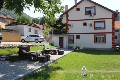 a house with a yard with a patio at Guest Accommodation Zone in Niška Banja