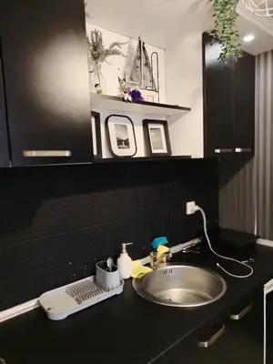 a bathroom counter with a sink and a sink at Studio ARIES in Vrnjačka Banja