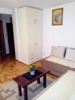 a living room with a couch and a coffee table at Apartment Laća in Vrnjačka Banja