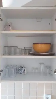 a shelf with a bowl and other items on it at Apartment Laća in Vrnjačka Banja