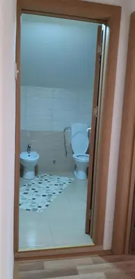 a bathroom with a toilet and a sink at Apartments Holiday in Vranje