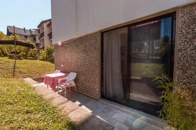 a patio with a table and chairs next to a building at Kuća Jankovića in Vrnjačka Banja
