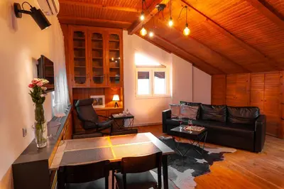 a living room with a couch and a table at Kuća Jankovića in Vrnjačka Banja