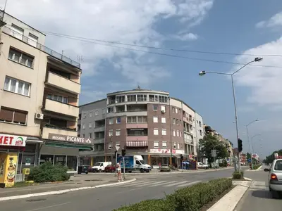 a street with a building on the side of the road at La Apartamento in Jagodina