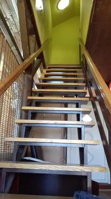 a set of stairs in a room with a green wall at Sweet dreams in Zaječar