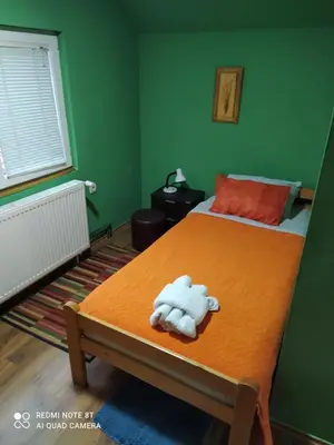 a bed with a stuffed animal on top of it at Sweet dreams in Zaječar