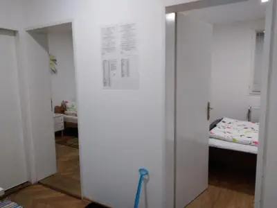 a room with a door open to a bedroom with a bed at Apartman Linera in Soko Banja