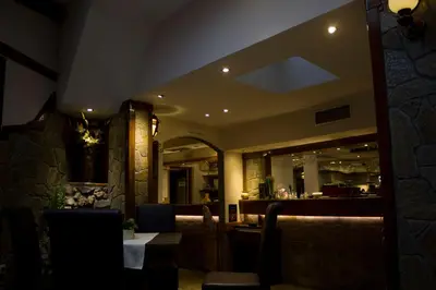 a restaurant with a bar in the background at DuoD in Niš