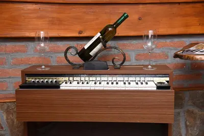 a wine bottle sitting on top of a keyboard at DuoD in Niš
