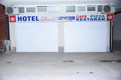 a large white garage door with a hotel sign on it at DuoD in Niš