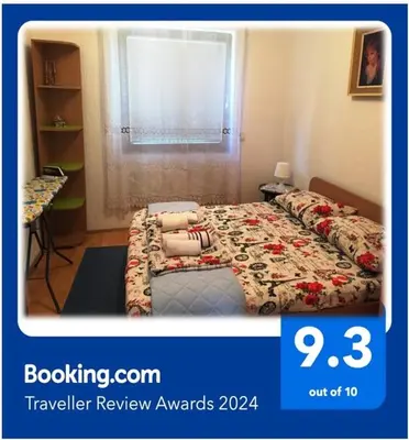 a poster of a bedroom with a bed in a room at Niš Apartman in Niš
