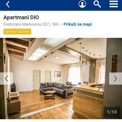 a living room with a couch and a table at Apartmani DiO in Niš