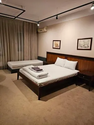 a bedroom with two beds in a room at Central Plaza Apartments in Niš