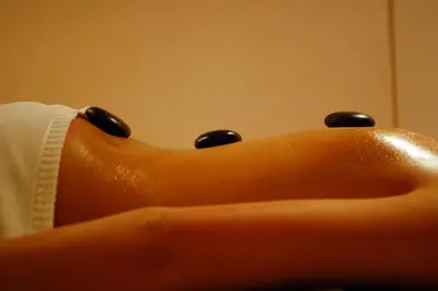 a woman with black nail polish on her leg at IWA CENTAR Apartments & Wellness in Vrnjačka Banja