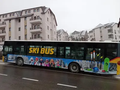 a bus parked on the side of a street at Apartman Sladjana Premier 12 Milmari in Kopaonik