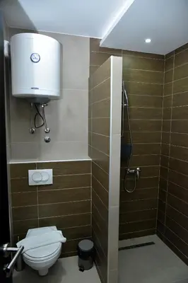 a bathroom with a toilet and a shower at Apartman Sladjana Premier 12 Milmari in Kopaonik