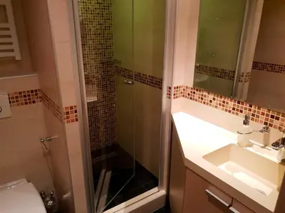 a bathroom with a shower and a sink at Apartment Superior Centar in Kopaonik