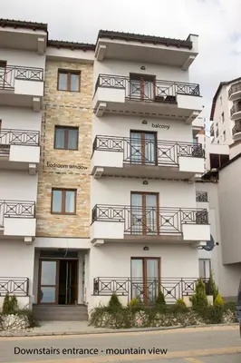 a building with balconies on the side of it at Fabulous Luxury Apartment G7 in Kopaonik